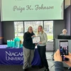 Paige Johnson (right) receives her Social Work Student of the Year award from Cheryl Eberl, of the National Association of Social Workers-New York State Western Division.