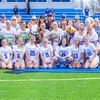 lacrosse students on the field with flowers and photos