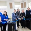 Emeritus Professor Phyllis East (third from right) and Yamaha representative Dom Cicchetti (second from right) join the Piano Lab ribbon-cutting ceremony with (from left) Operations Manager Marc Levy, Assistant Professor Jiyong Kim Mai, Vice President for Student Affairs Tracy Stenger, SUNY Distinguished Professor James Davis and Fredonia College Foundation Major Gifts Officer Tim Smeal.