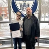 Grace Riodan, with her RA of the Month certificate, Residence Director of University Commons and Gregory Hall Jacob Steinhoff. 