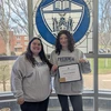 Aileen Richardson displays her Resident Assistant of The Month certificate presented by Kasling Hall Residence Director Sabrina Sosa.