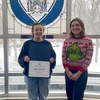 Maisie Strader, with her Student of the Month certificate, and Donna Good West, residence director of Chautauqua Hall. 