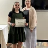 Reyna Reisner, with her Growth Award certificate, and Briana Postle.