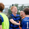 soccer players celebrating by Riley Olson
