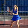 tennis player in action by Travis Bernhard