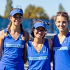 three seniors standing in uniform on tennis court by Travis Bernhard