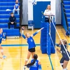 volleyball players in action by Travis Bernhard