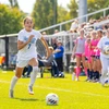 soccer player in action by Travis Bernhard