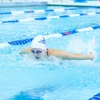 woman swimming the butterfly in the pool