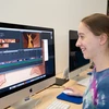 A student prepares an animation short on a computer. Graphic design degree, degree in graphic design, major in graphic design.  graphic design program, graphics design schools 