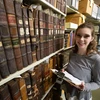 A Fredonia student looking for answers in the archives. Major in history, jobs for a history major, history major, degree in history.