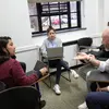Fredonia students engaging with a professor in an accounting class, working in the accounting program, accounting degree as an accounting major toward a degree in accounting