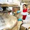 Dr. Allan Cardenas assists Alex Green in a Science Center lab. Biochemistry major, major in biochemistry, biochemistry degree.