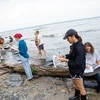 a geology class examines rock specimens. Students at Fredonia can earn a Geology degree, Geologist degree | Degree in geology