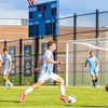 soccer players in action on the field